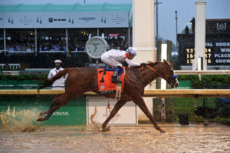 Mike Smith Justify, ridden by jockey Mike Smith, wins the 144th Kentucky Derby, the wettest in history, on Saturday, May 5, 2018, at Churchill Downs in Louisville, Ky. Longines, the Swiss watch manufacturer known for its luxury timepieces, is the Official Watch and Timekeeper of the 144th annual Kentucky Derby. (Photo by Diane Bondareff/Invision for Longines/AP Images)