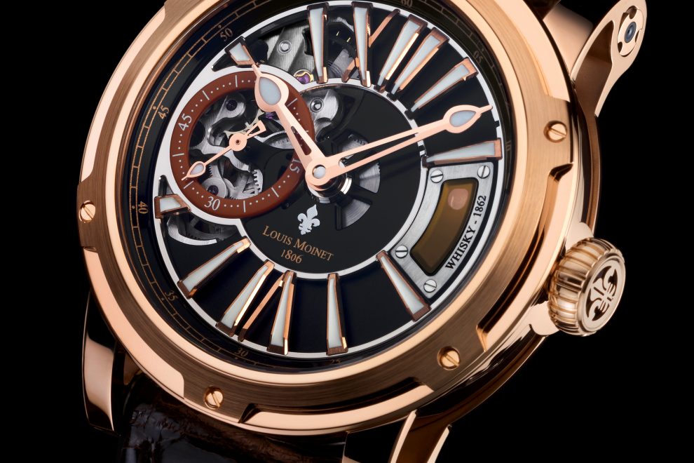 WHISKYWATCH_GOLD_HD_BB The Louis Moinet Whiskey Watch features a tiny capsule of rare Vatted Glenlivet 1862 whiskey, visible at 3:00 on the dial.
