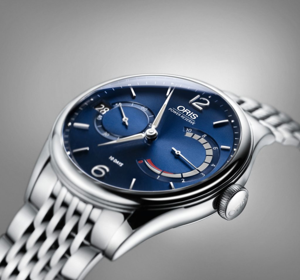 The Oris Artelier Caliber 111 with blue dial features an arch-shaped power reserve. 