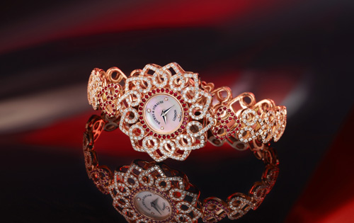 This Backes and Strauss Victoria Princess Red Heart watch was inspired by a 19th century brooch found in the company’s archives.  The interlocking hearts are the focal point. The watch uses Ideal-cut diamonds and rubies. 