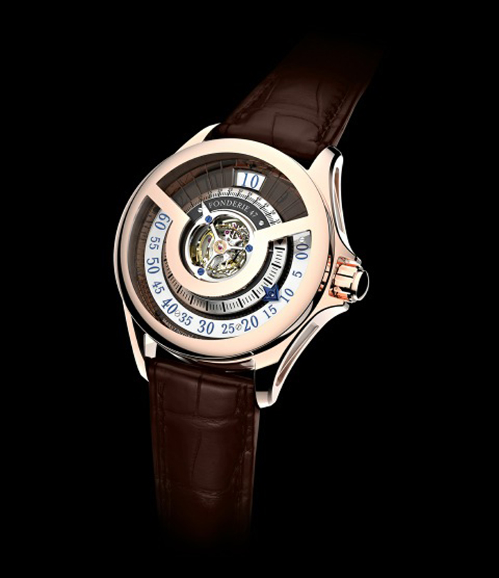 Fonderie 47 unveils the Inversion Principle second edition in rose gold. It features three-dimensional indications rising from the 240° numbers on the flat retrograde minutes ring to the inner inclined minute markers. The blued minute hand has an inclined inner arrow following the angle of the minute marker track.
