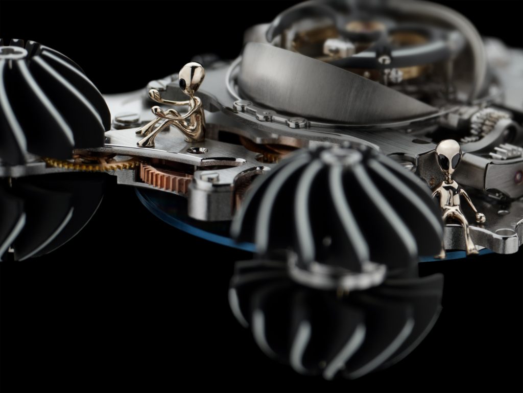 In addition to the pilot alien that sits in the MB&F HM6 Alien Nation case between two of the turbines, there are five more alien crew members inside the watch. 