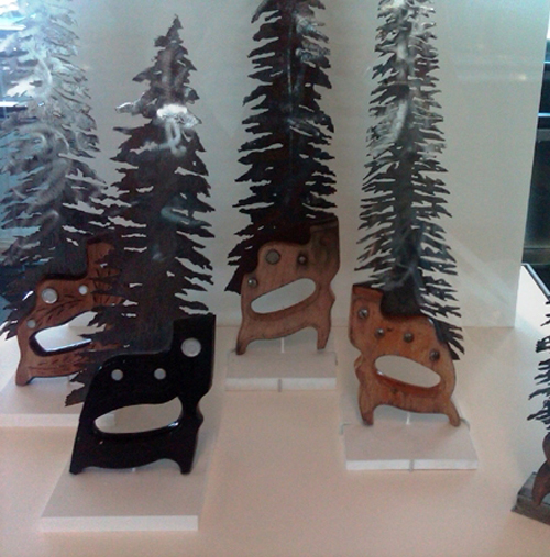 Recycled saws made into Evergreen trees.