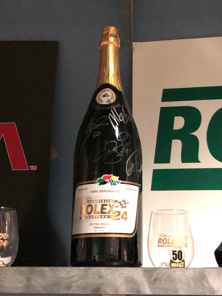 Signed Rolex champagne bottle as