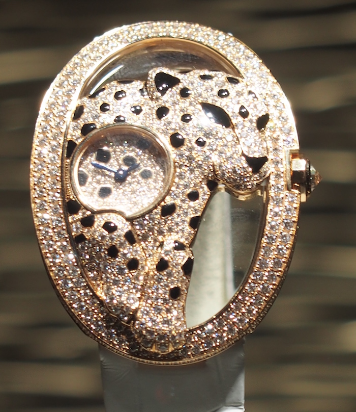 The panther encircles the watch dial in this stunning Cartier watch