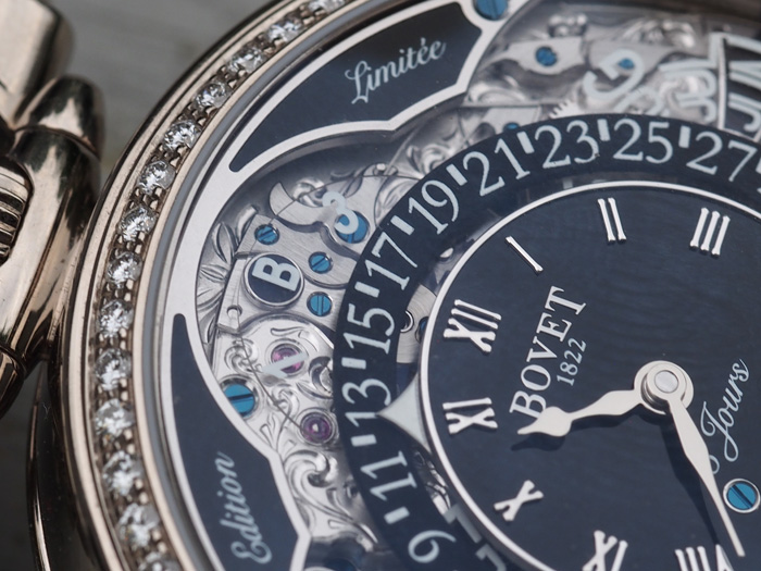 The engraving work is all hand done and is visible beneath the sapphire calendar  disks