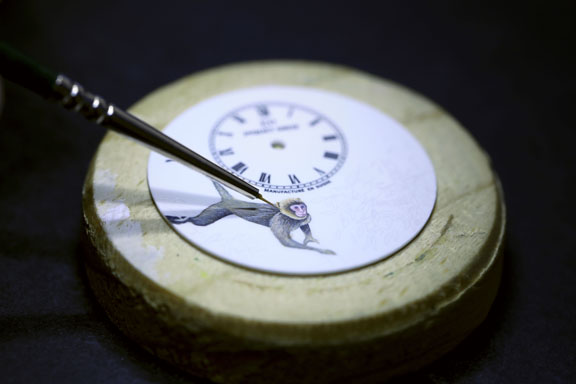 Hand painting on the ivory enamel dial is time consuming and exacting.