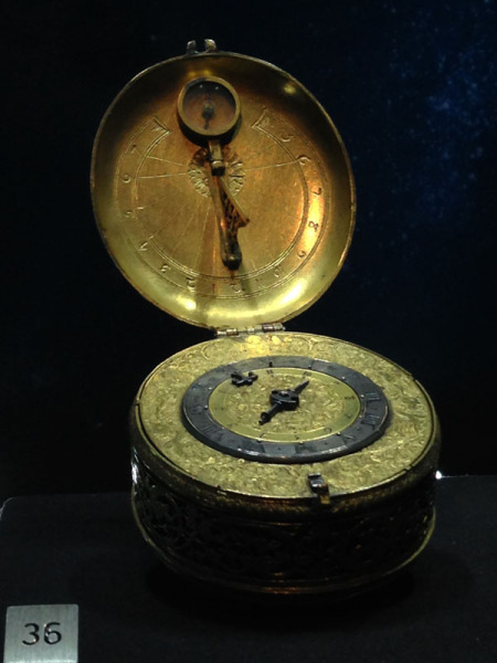 Pendant alarm watch circa 1590 in the form of a sundial with compass for setting time. 