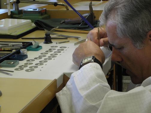 The specialists work to decorate and quality-control each movement component 