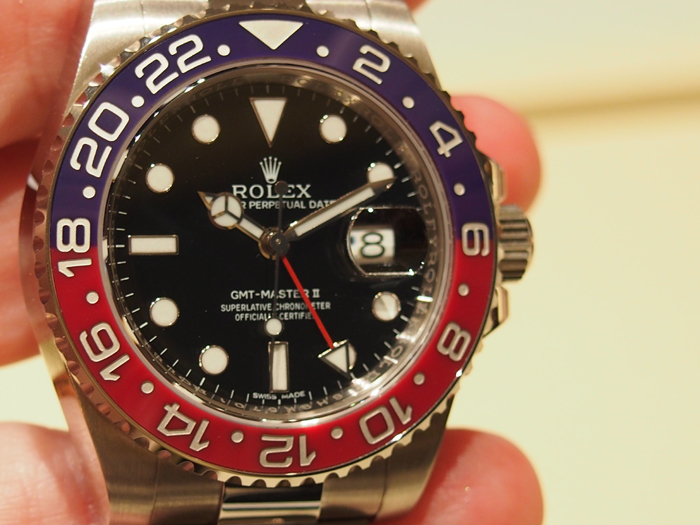 Rolex Oyster Perpetual GMT Master II watch features a distinctive red and blue Cerachrom bezel. 