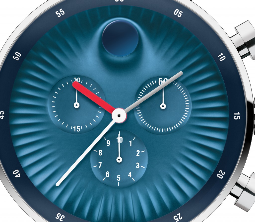 The dial is concave, but the famed dot raises upward from the dial. 