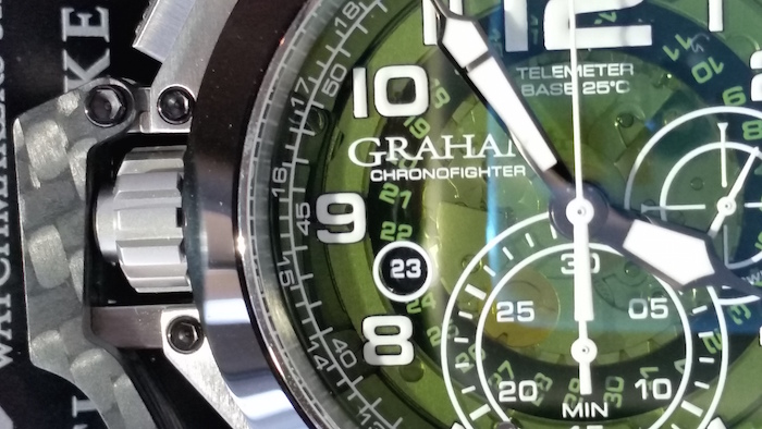 The automatic  watch features a green smoked crystal