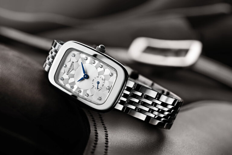 in the shape of its stainless-steel case, this Longines Equestrian timepiece features a silver-coloured “damier” dial enhanced by blued-steel hands and adorned with diamond indexes. The polished stainless-steel case and bracelet are further enhanced by the 60 Wesselton VVS diamonds, for a total of 0.504 carats, surrounding its bezel.