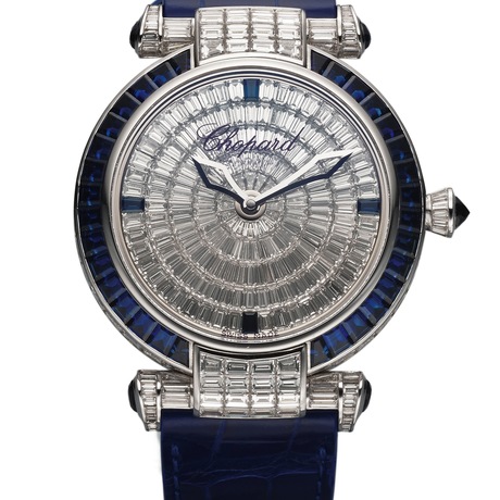 Chopard Ref. 4240 Imperiale White Gold Diamond & Sapphire. Sold in 2014, this is an extremely fine and very impressive, 18K white gold wristwatch set with baguette diamonds and baguette sapphires and an 18K white gold Chopard buckle set with 48 round diamonds and 10 calibrated baguette sapphires. Est. $200,000 to $300,000 
