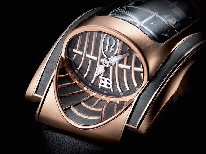 The Parmigiani Bugatti Mythe is crafted in 18-karat rose gold and the dial emulates the car grille.  