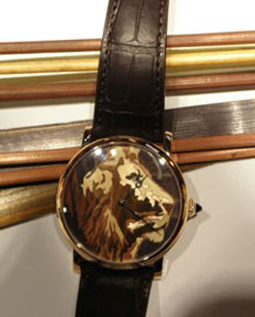 Marquetry lion motif dial consisint of hundreds of pieces of wood. 