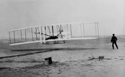 The Wright Brothers at Kitty Hawk. 