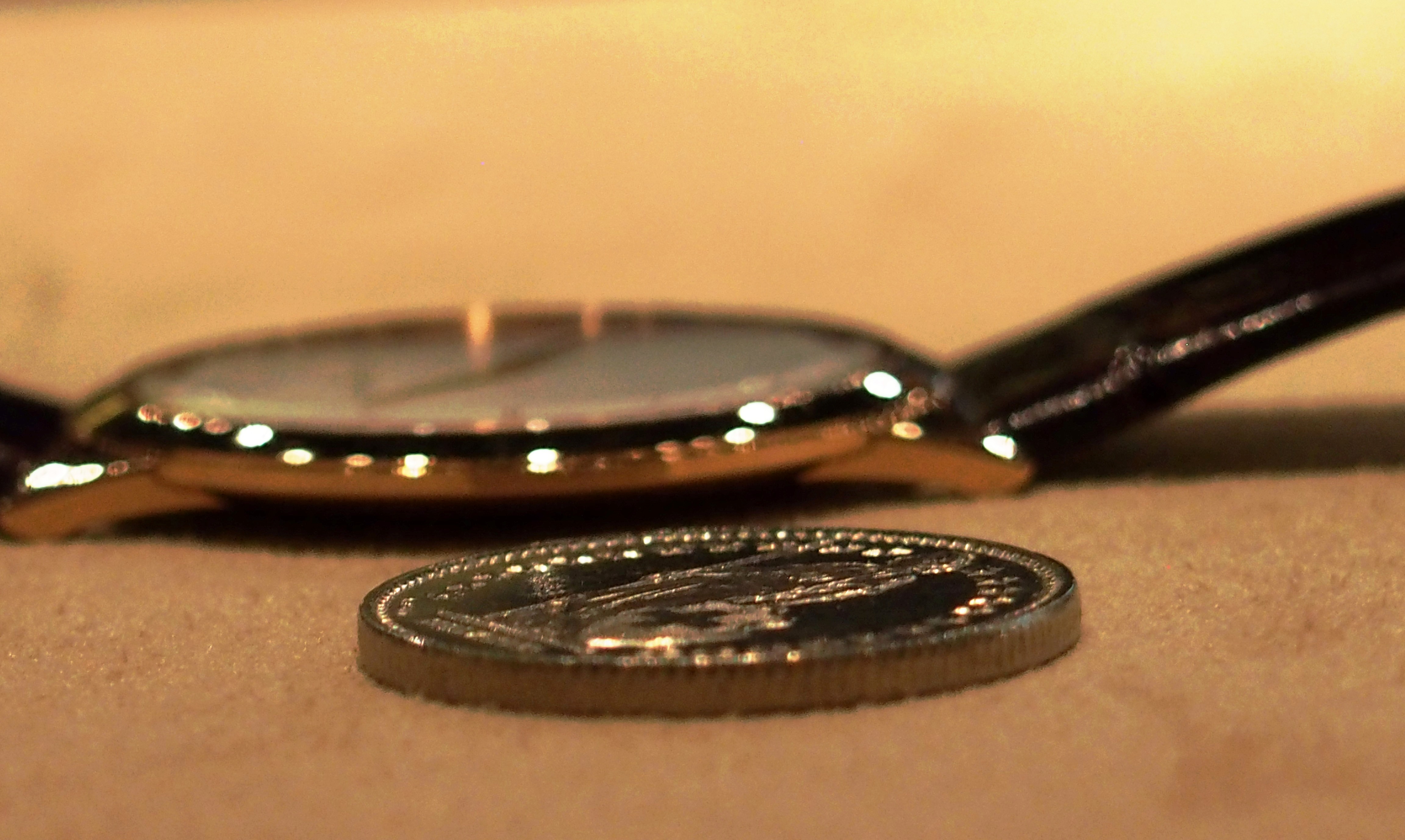 Jaeger-LeCoultre Master Ultra Thin 1907 next to a Swiss  coin. 